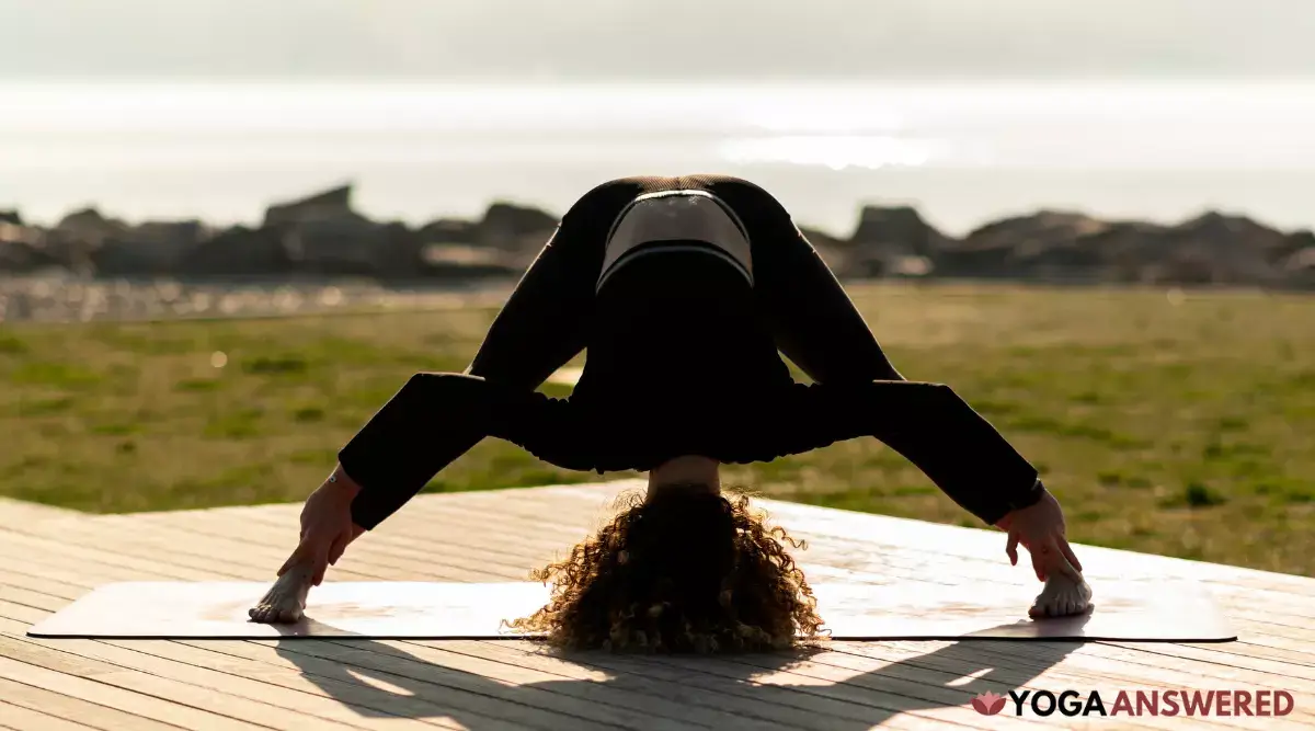 how to do wide-legged forward bend pose
